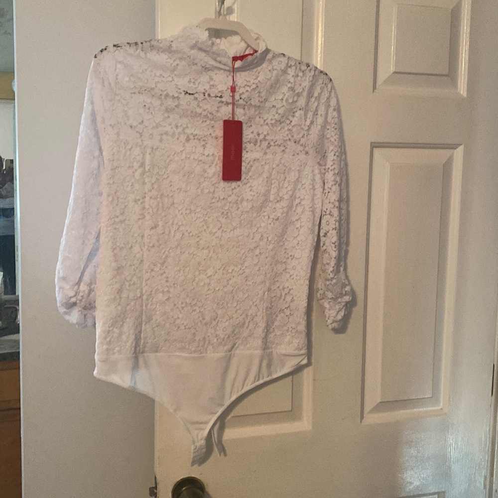 Sexy White Maer body suit. Lined with Long lace sleeves.